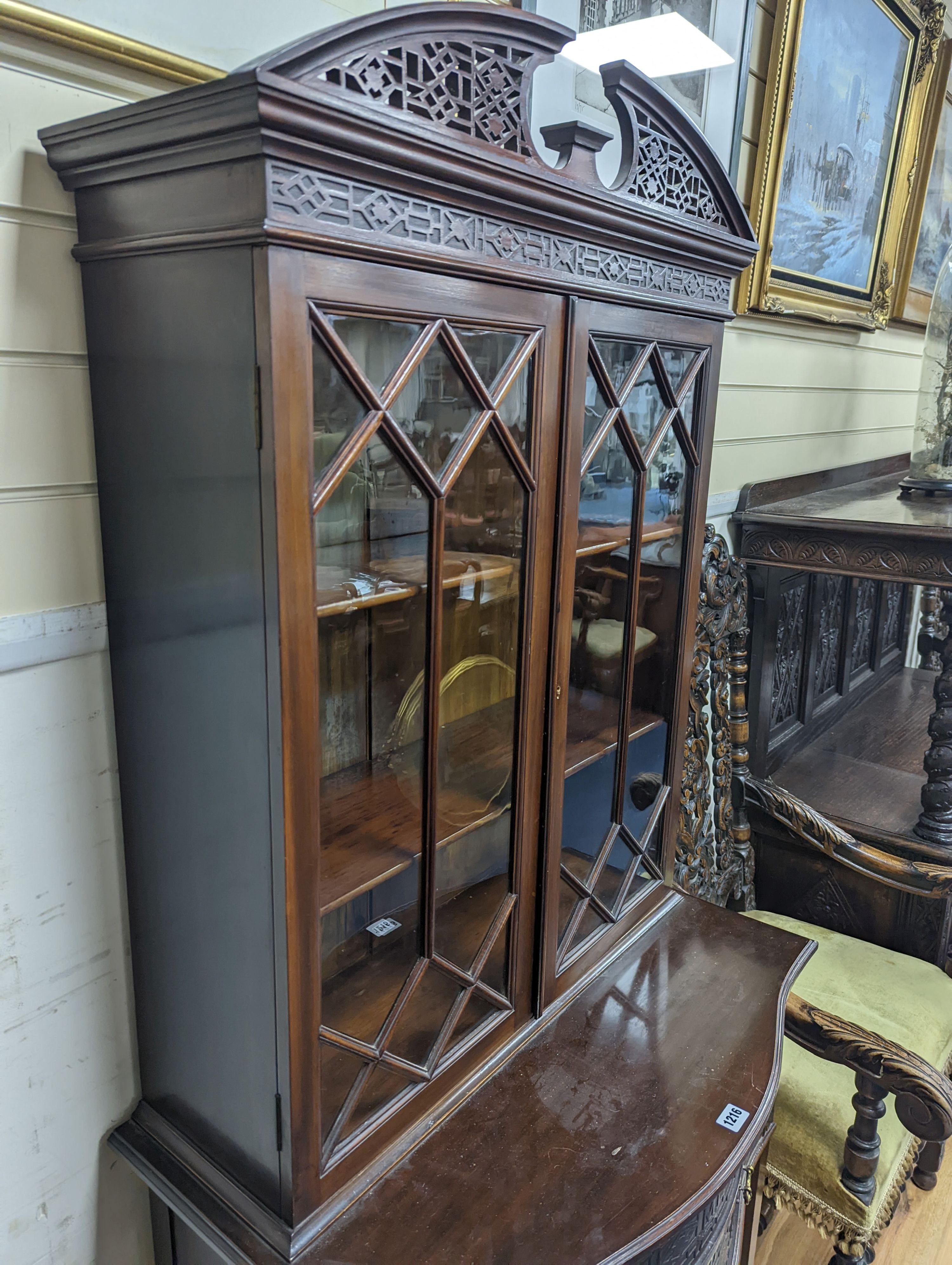 An Edwardian Chippendale revival serpentine mahogany display cabinet, width 76cm, depth 45cm, height 180cm